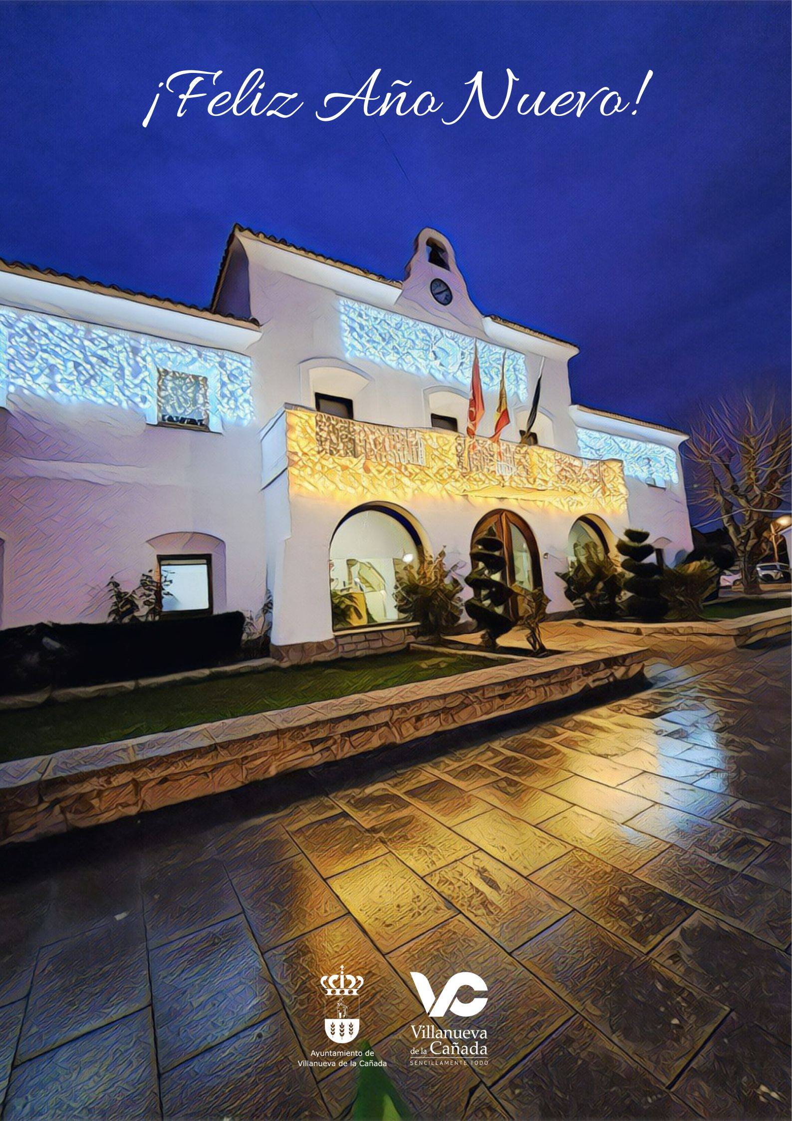 Imagen de la fachada del Ayuntamiento iluminado con el mensaje Feliz Año Nuevo y logos municipales.